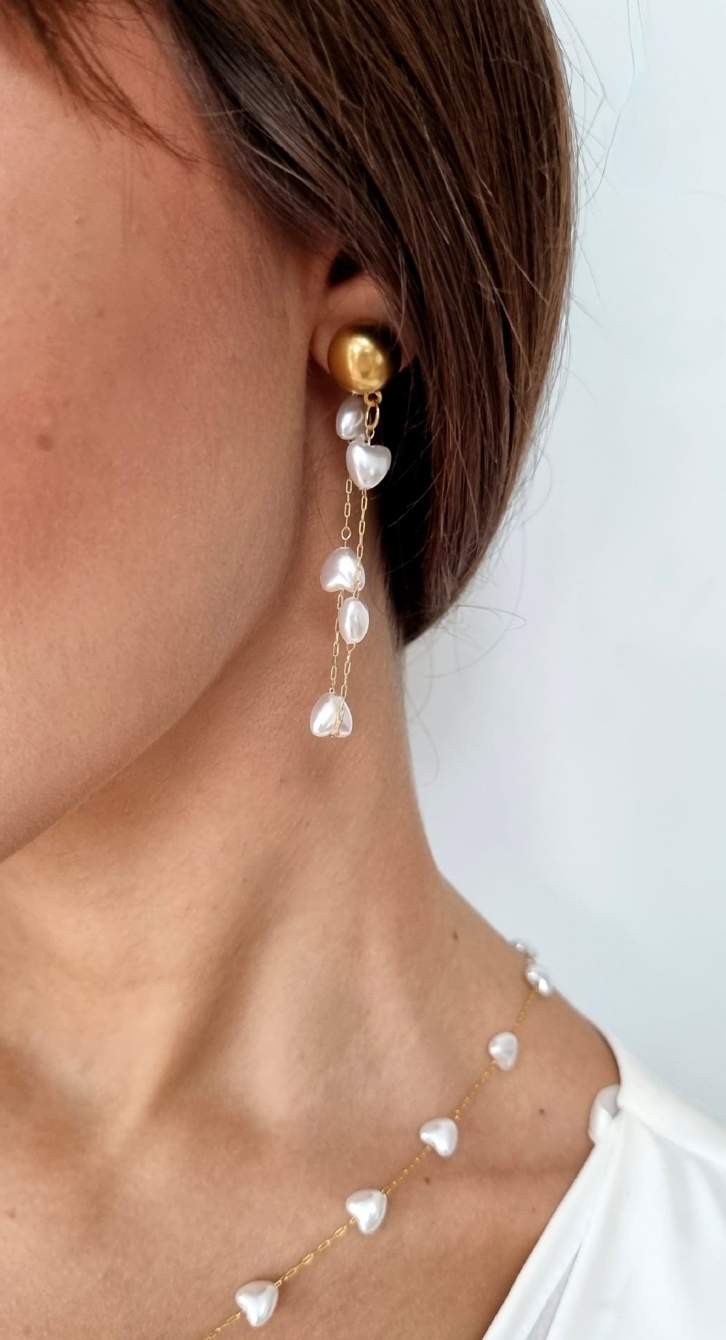 Earrings with heart shaped pearls
