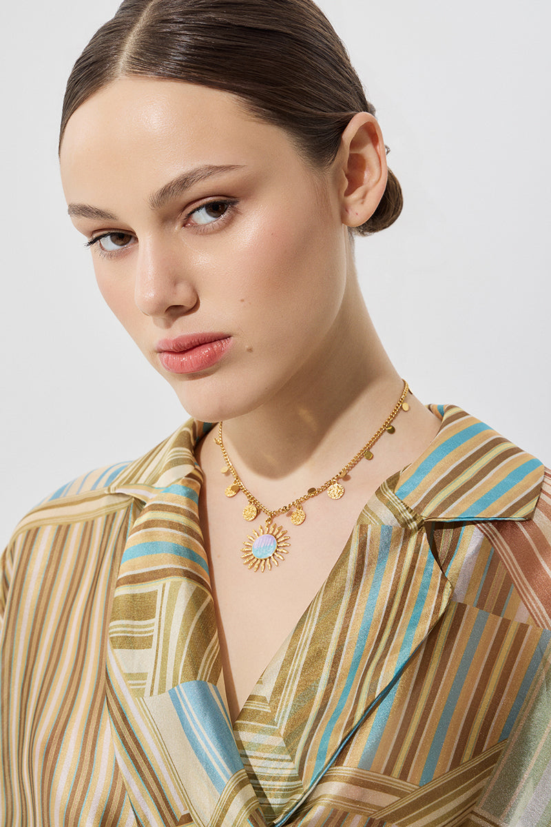 Steel necklace with a sun pendant