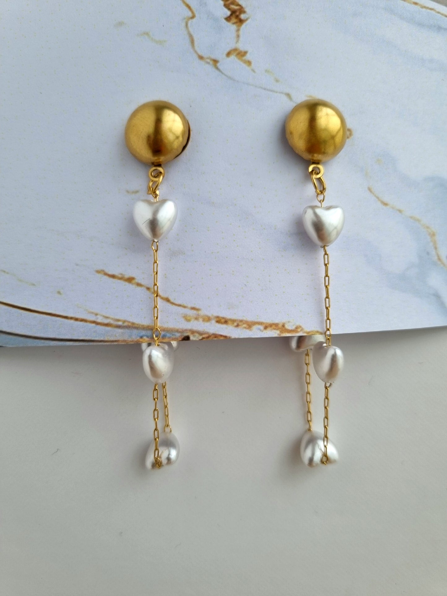 Earrings with heart shaped pearls