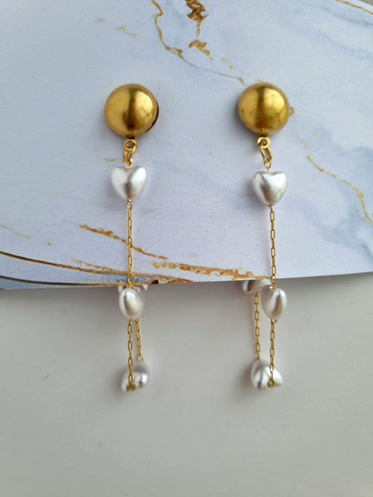 Earrings with heart shaped pearls