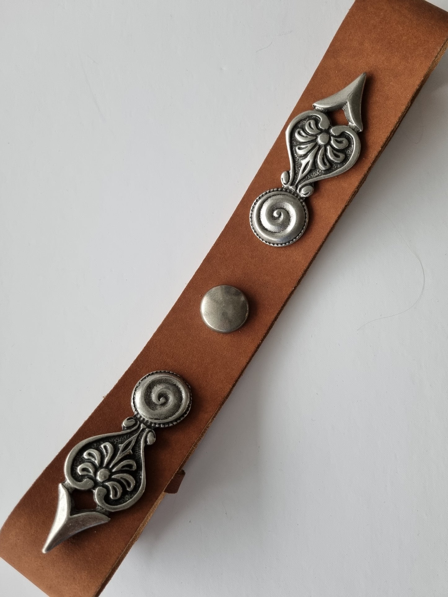 Leather belt with metal ornaments