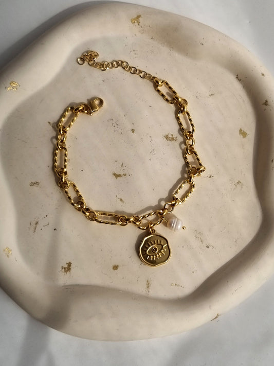 Steel anklet with steel eye charm and a pearl