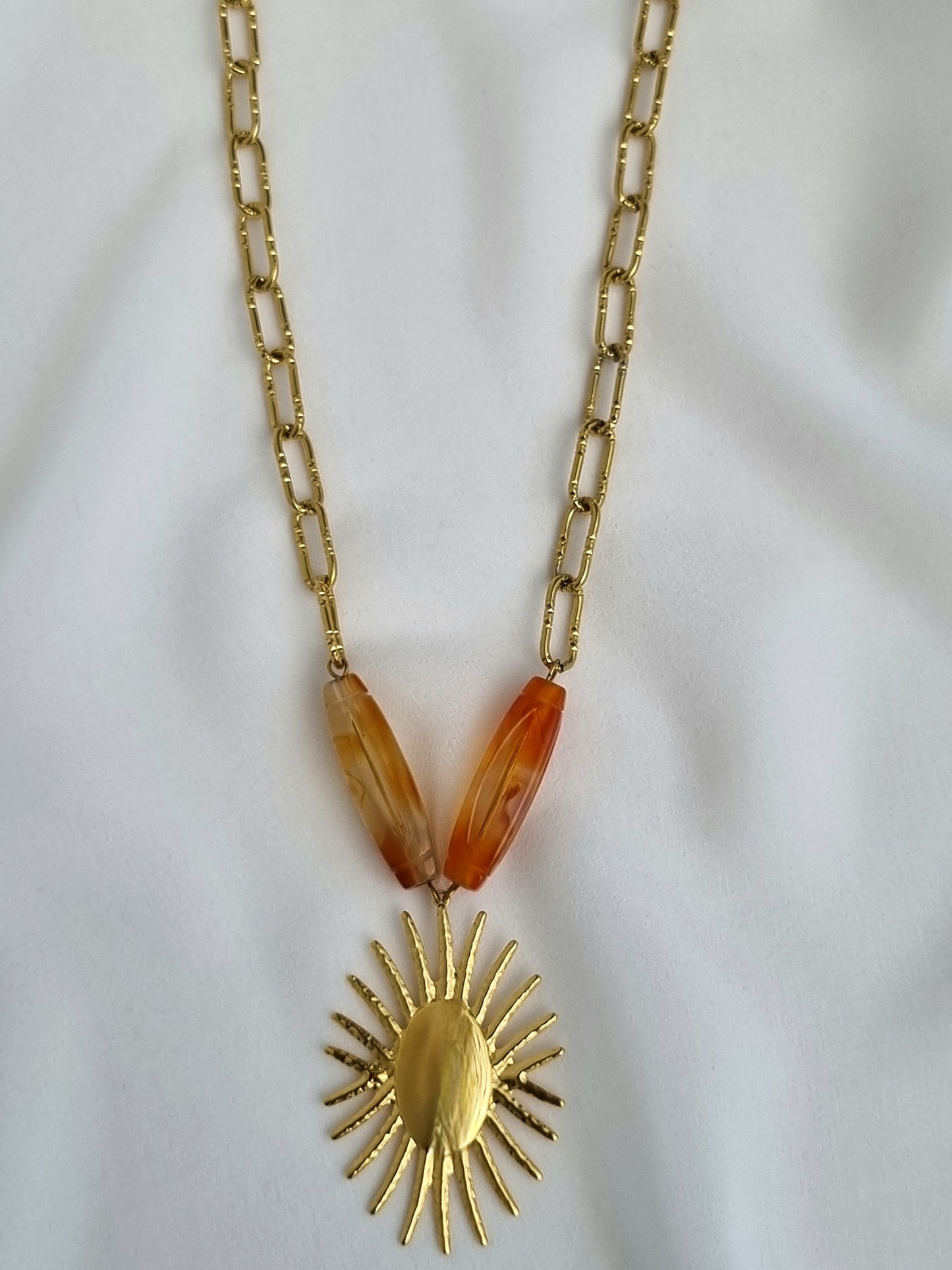 Necklace with a sun pendant