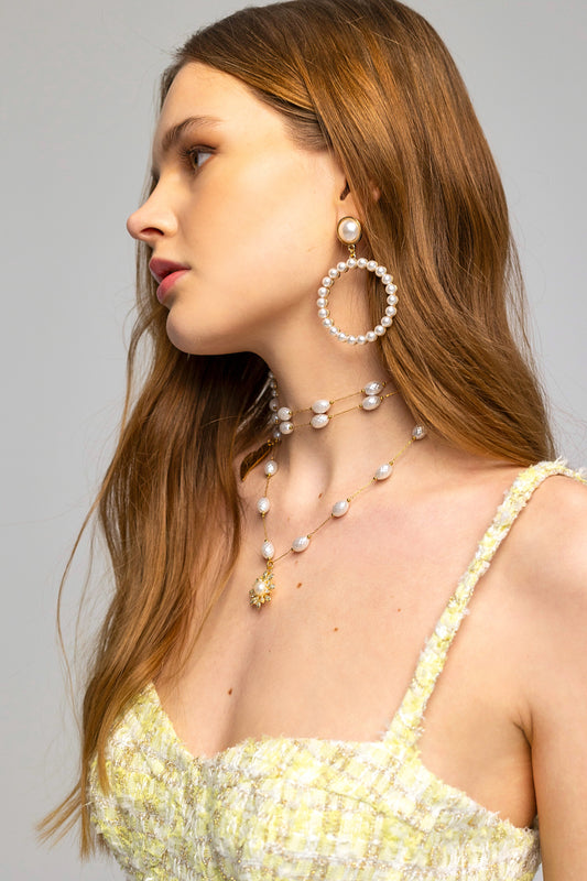 Steel necklace with pearls and a zircon flower