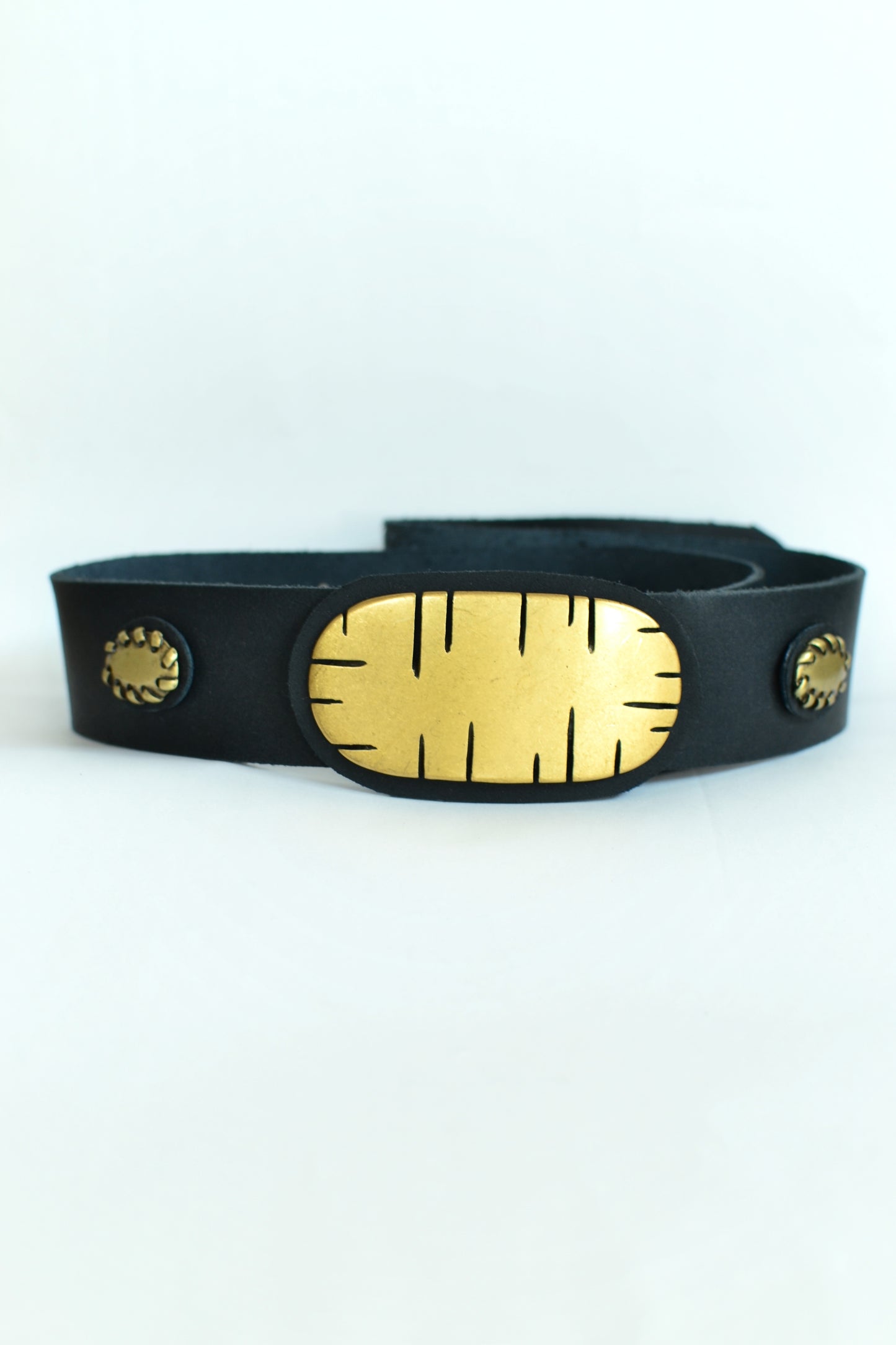 Leather belt with metal ornaments
