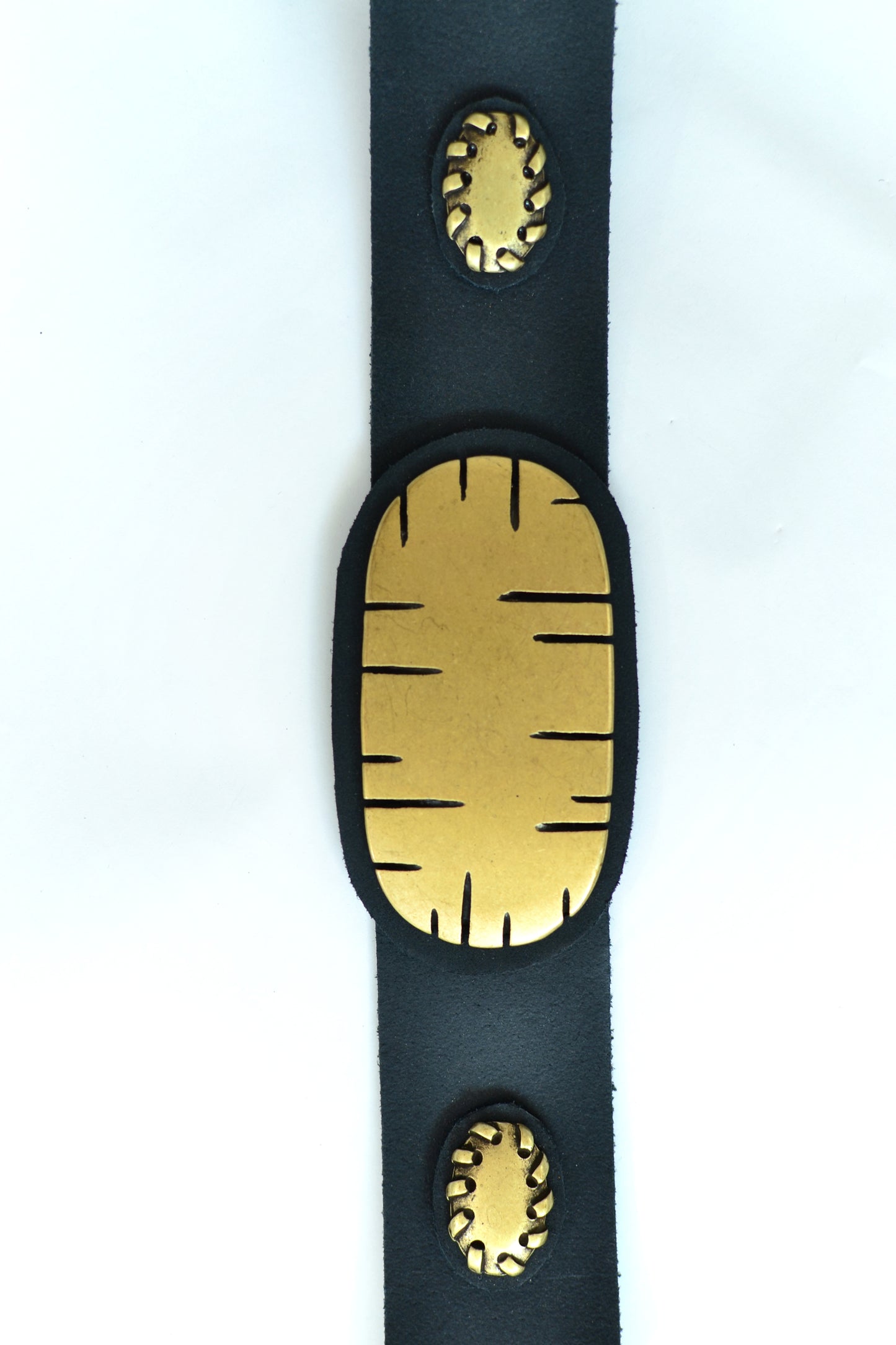 Leather belt with metal ornaments
