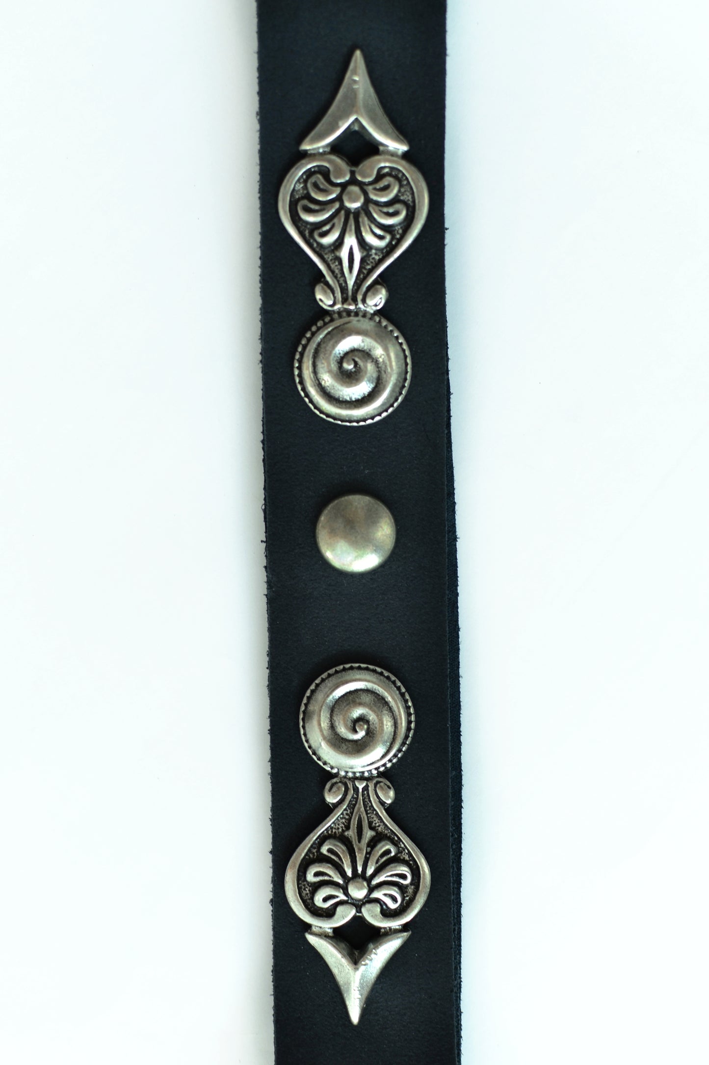 Leather belt with metal ornaments