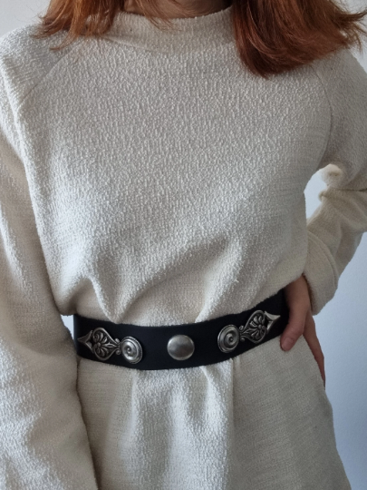 Leather belt with metal ornaments
